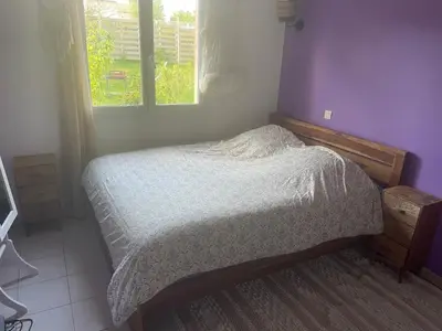a small bed in a room with a window at Villa avec piscine à mirepoix in Mirepoix