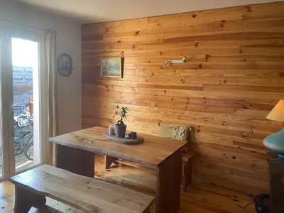 a wooden wall in a room with a wooden table at Villa avec piscine à mirepoix in Mirepoix