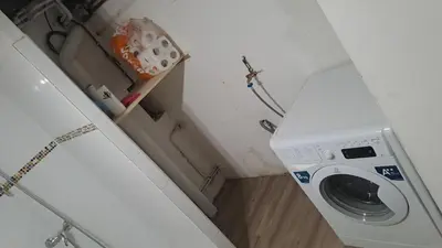 a washing machine in a small room with a counter at La Pause Verte - 30min de Castre in Montredon-Labessonnié