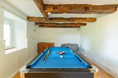 a pool table in a room with a ceiling at La Pause Verte - 30min de Castre in Montredon-Labessonnié