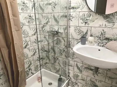 a bathroom with a sink and a shower at Les Studios de la Bastide in Carcassonne