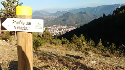 a sign on a pole on top of a mountain at Pyrenees,Hiking, Cycling, Rafting,Fishing,4 Bed Apartment, Roof Terrace in Quillan