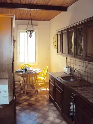 a kitchen with a table and a dining room at Pyrenees,Hiking, Cycling, Rafting,Fishing,4 Bed Apartment, Roof Terrace in Quillan