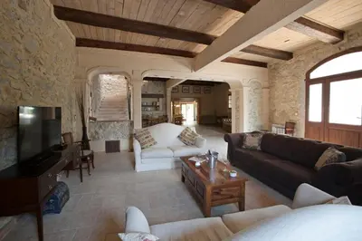 a living room with a couch and a tv at Gite Les 3F in Fontcouverte