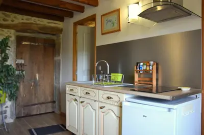 a kitchen with a sink and a counter top at gîte les Libellules in Saint-Salvy-de-la-Balme