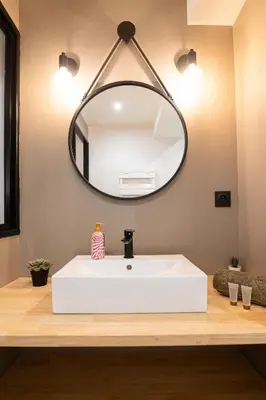 a bathroom with a white sink and a mirror at 203 Balcon de la Bastide in Carcassonne