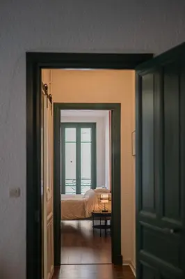 an open door to a bedroom with a bed at 203 Balcon de la Bastide in Carcassonne