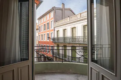 an open window with a view of a building at 203 Balcon de la Bastide in Carcassonne