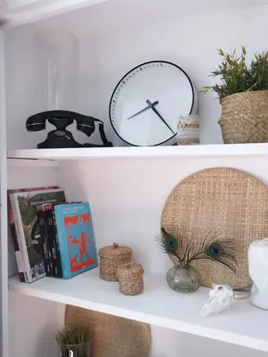 a clock and other items on a shelf at T2 Design Centre Cité 10 min in Carcassonne