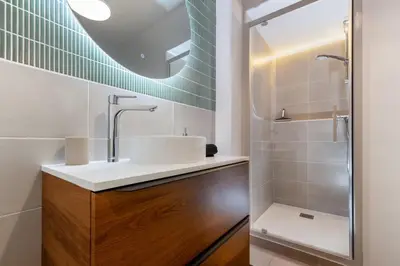 a bathroom with a sink and a shower at T2 Design Centre Cité 10 min in Carcassonne
