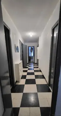 a hallway with a black and white checkered floor at Chambre 2 - avec grande terrasse in Port-la-Nouvelle
