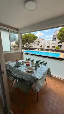 a table with plates of food on top of a balcony at Ondine in Gruissan
