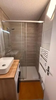 a bathroom with a shower and a sink at Ondine in Gruissan