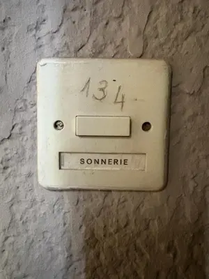 a lightswitch on the side of a wall at Ondine in Gruissan