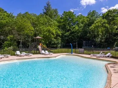 a swimming pool with chairs and a playground at Tente Toile & Bois - 2 Chambres, Terrasse - API-1-52-789 in Fenouillet