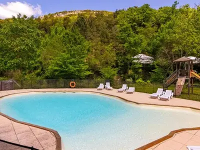 a swimming pool with chairs and a slide at Tente Toile & Bois - 2 Chambres, Terrasse - API-1-52-789 in Fenouillet