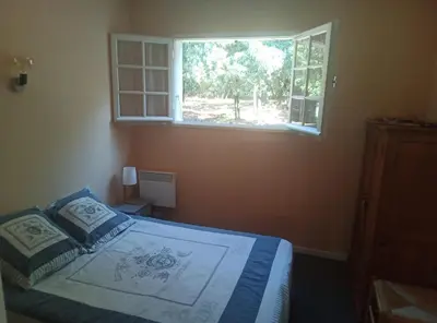 two twin beds in a room with a dresser at Les Yeuses in Brousses-et-Villaret