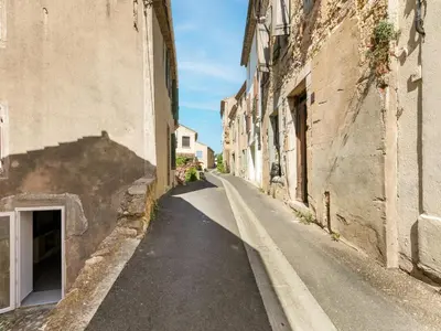 an empty street in an alley between two buildings at Holiday Home in Montouliers near Nature Reserve in Montouliers