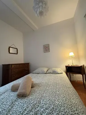 a bedroom with a bed with a dresser and a desk at Le Capucin Terrace Hypercentre in Castres