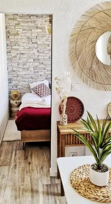 a bedroom with a bed and a mirror at N2 Barbacane-Pieds Cité-Bohème Chic-Clim Mobile in Carcassonne