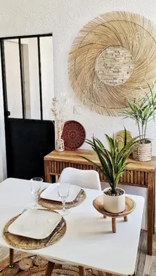 a dining room with a white table with a plant on it at N2 Barbacane-Pieds Cité-Bohème Chic-Clim Mobile in Carcassonne