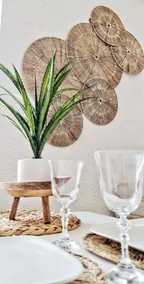 a table with three wine glasses and a potted plant at N2 Barbacane-Pieds Cité-Bohème Chic-Clim Mobile in Carcassonne