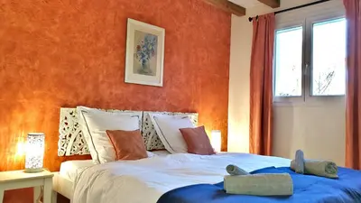 a bedroom with a bed with two stuffed animals on it at The Grange in Roquetaillade