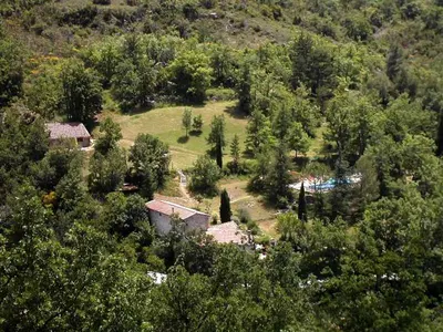 an aerial view of a house in a forest at The Studio in Roquetaillade