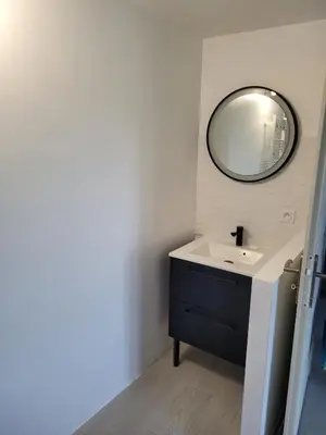 a bathroom with a sink and a mirror at Chez Louise in Arboussols