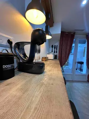 a room with a table with a hair dryer on it at House Patio Air Conditioning Elegant Decoration in Carcassonne