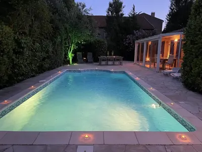 a swimming pool in a backyard at night at Villa in Saint-Couat with Private Pool in Saint-Couat-dʼAude