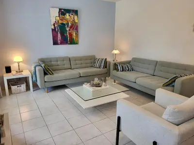 a living room with two couches and a table at Villa in Saint-Couat with Private Pool in Saint-Couat-dʼAude