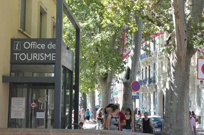 a group of people walking down a city street at Le Loft De La Robine 110m2 in Narbonne