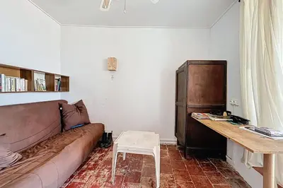 a living room with a couch and a table at Charming house with terrace and breathtaking views in Bages
