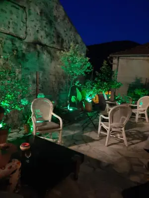 a group of chairs sitting on a patio at night at Chez Pet and Jo in Olargues