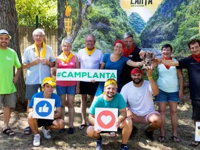 a group of people posing for a picture with signs at Mobil-home confortable avec terrasse - API-1-52-652 in Lézignan-Corbières