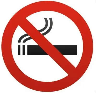 a red no smoking sign with a cigarette at Appartement Du DONJON in Carcassonne