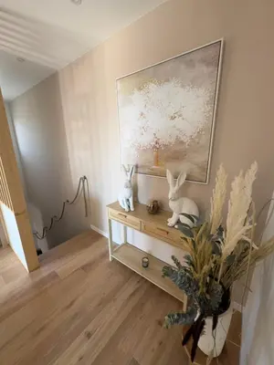 two rabbits sitting on a table in a room with a painting at Modern villa with sea view in Fitou