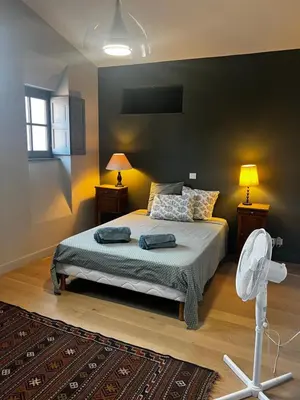 a bedroom with a bed with two pillows on it at Maison Gally Historic Luxury in Carcassonne