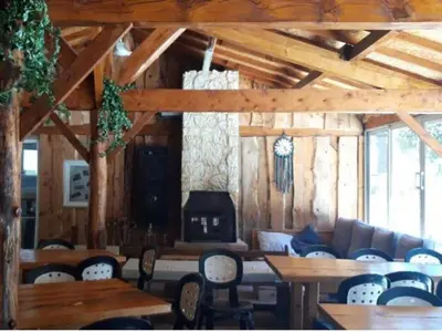 a living room with a couch and tables and chairs at Mobil-home avec Terrasse Accueillant 6 Pers - API-1-52-631 in Sournia