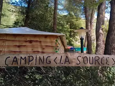 a sign in front of a tent in a park at Mobil-home avec Terrasse Accueillant 6 Pers - API-1-52-631 in Sournia