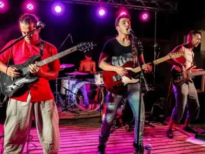 a group of people on a stage playing guitars at Mobil-home avec Terrasse Accueillant 6 Pers - API-1-52-631 in Sournia