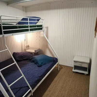 a bunk bed in a small room with a bunk bedutenewayangering at Chalet atypique in Anglès