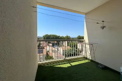 a balcony with a view of a building at Apartment with view quiet and comfort in Narbonne in Narbonne