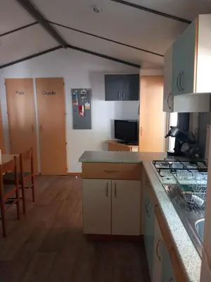 a kitchen with a sink and a counter top at Mobil Home La Belle Vie in Vaudreuille