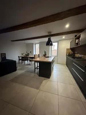 a kitchen and dining room with a table in it at Asta house in Cébazan
