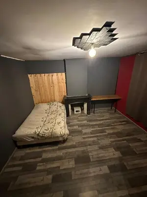 a room with a bed and a table in it at Asta house in Cébazan