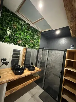 a bathroom with two sinks and a shower at Asta house in Cébazan