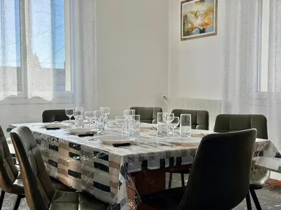 a table with glasses on it in a room at L'Horizon de la Cité in Carcassonne