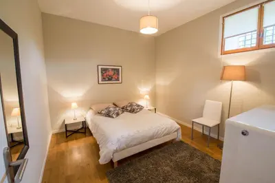 a small bedroom with a bed and a window at l'Ecrit Vin in Rustiques